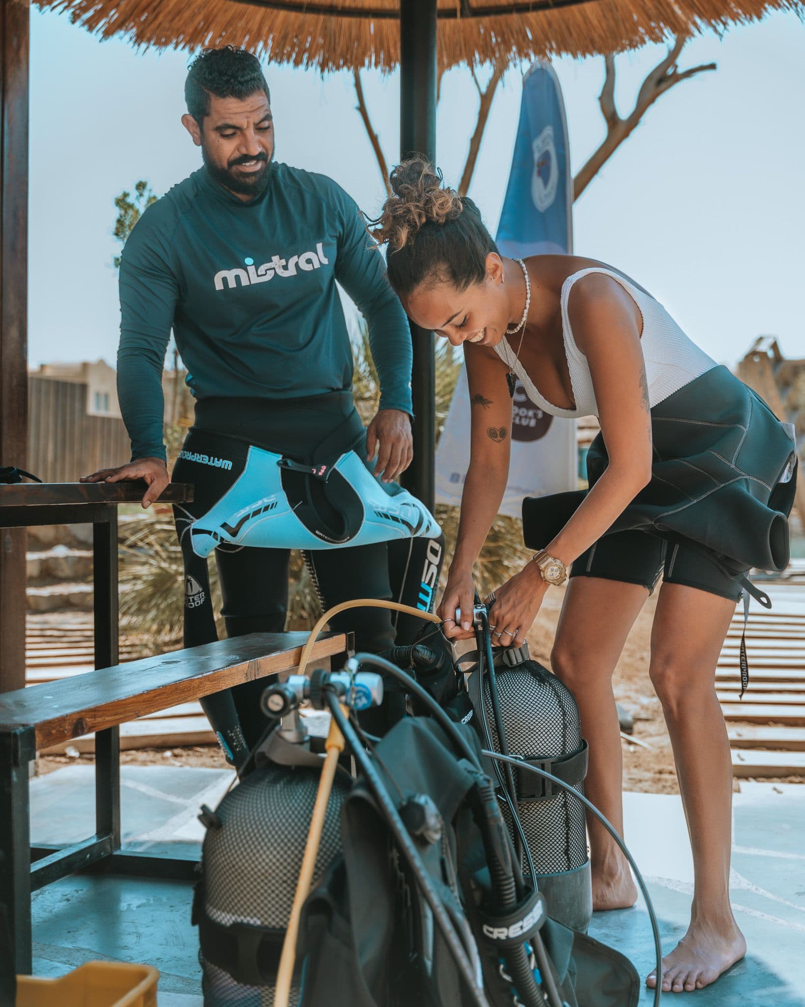 Open Water Diver students assembling scuba equipment at the dive center