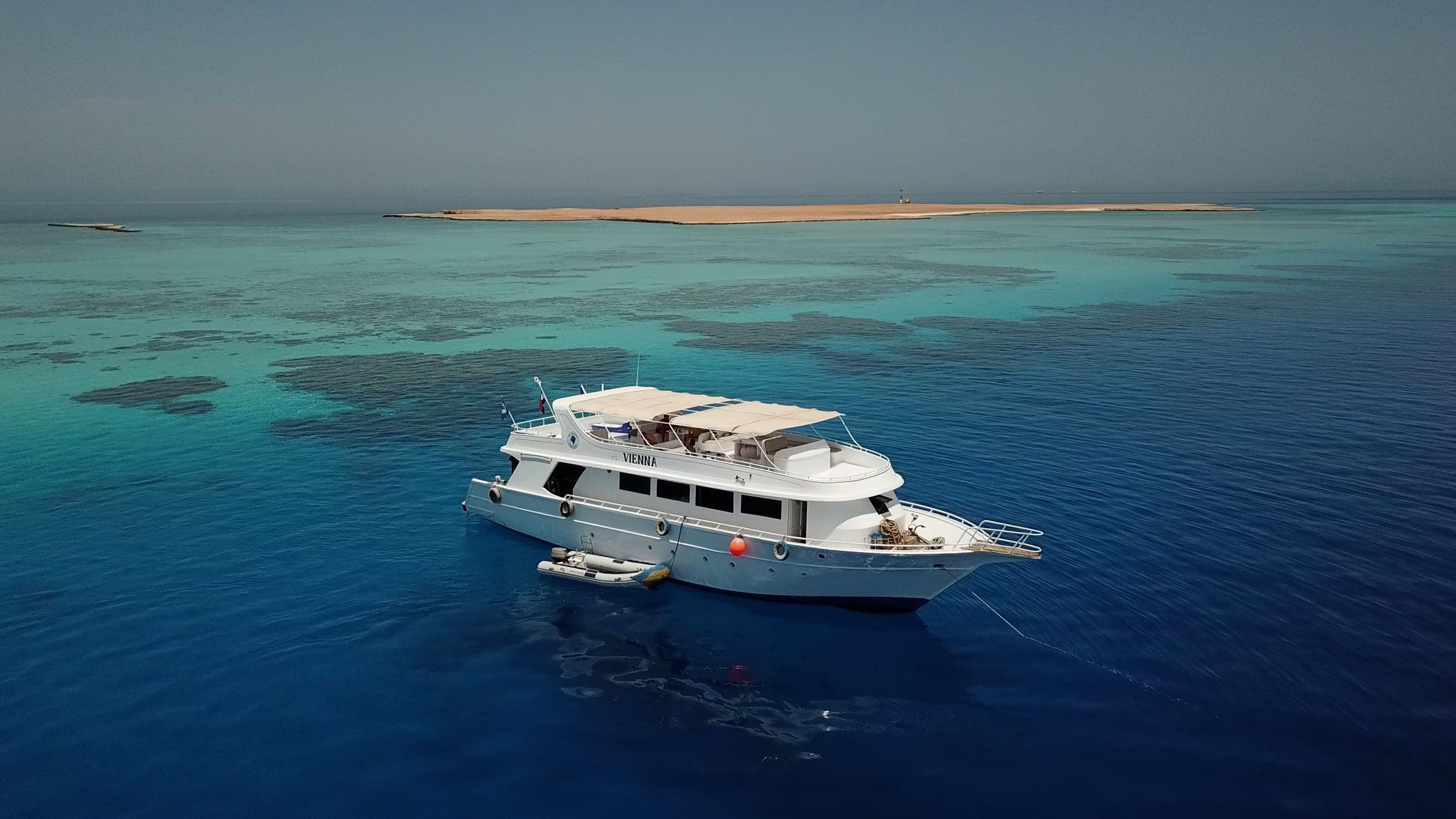 Blue Brothers day boat anchored in turquoise Red Sea water